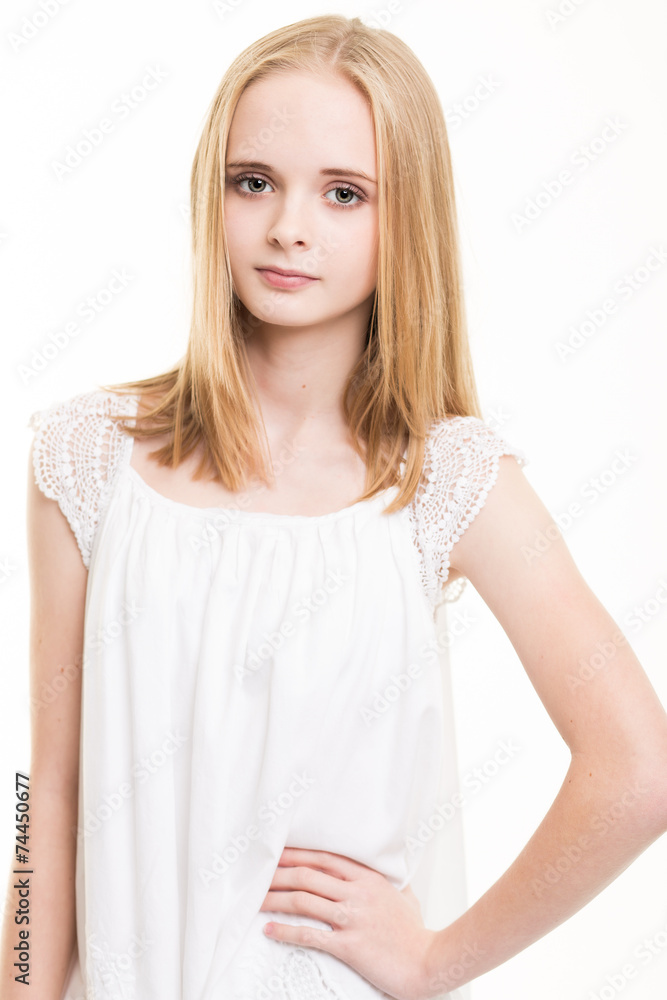 Blond Young Teenage Girl Dressed In White in the Studio Blond Young Teenage Girl Dressed In White in the Studio