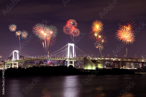 Fireworks celebrating over Tokyo Rainbow Bridge at Night, Japan
