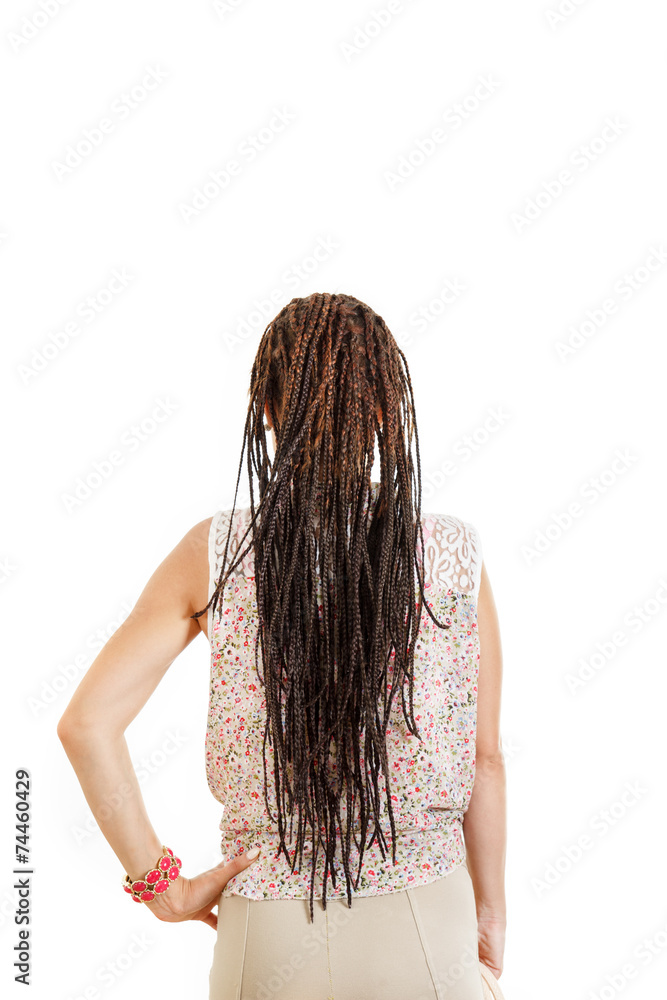 Naklejka premium woman with back facing away from camera with extended braids ha
