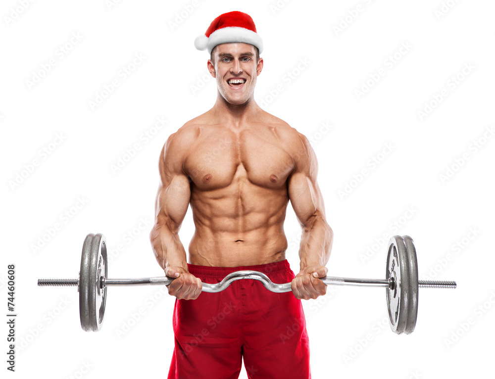 Fototapeta premium Muscular bodybuilder Santa Claus doing exercises with dumbbells