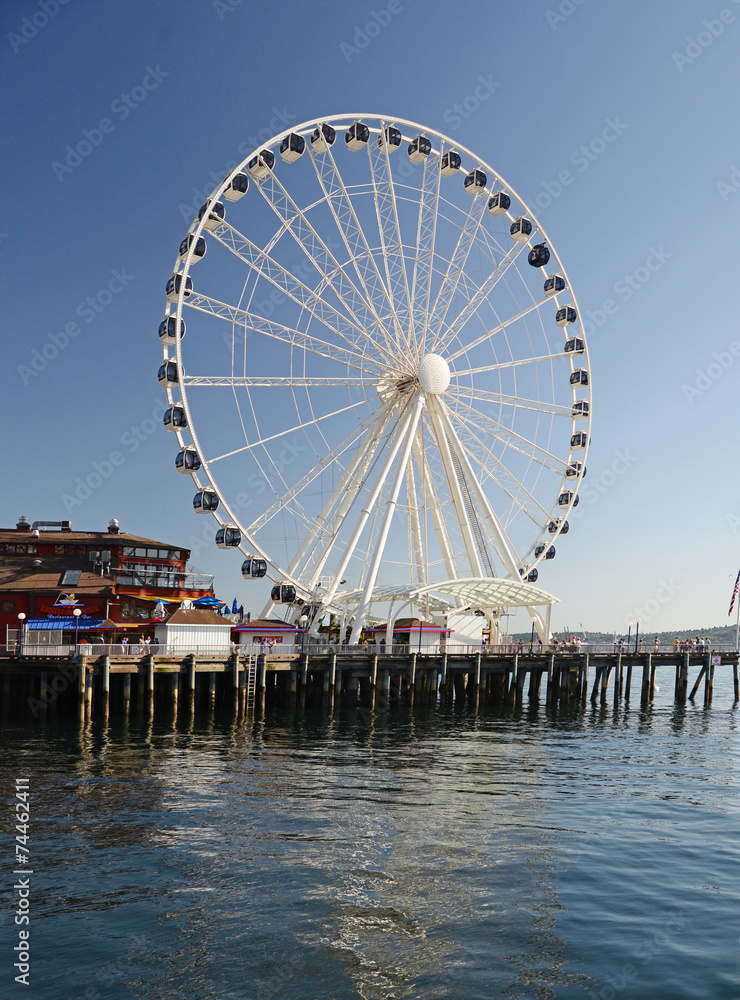 A view  of the piers in downtown Seattle. Tourists throng to the piers which are centers for entertainment.