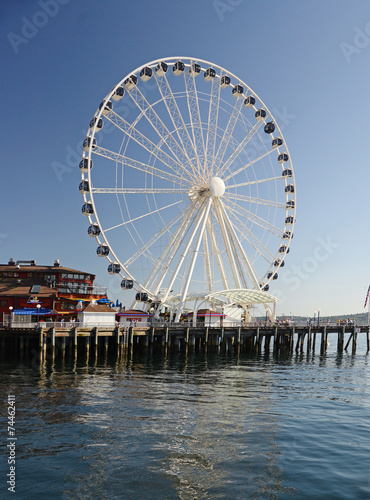 A view  of the piers in downtown Seattle. Tourists throng to the piers which are centers for entertainment. © efaah0