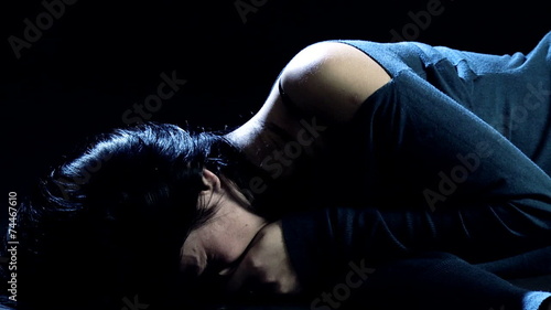 Woman crying desperate on the ground
