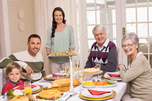 Woman holding christmas dinner with family