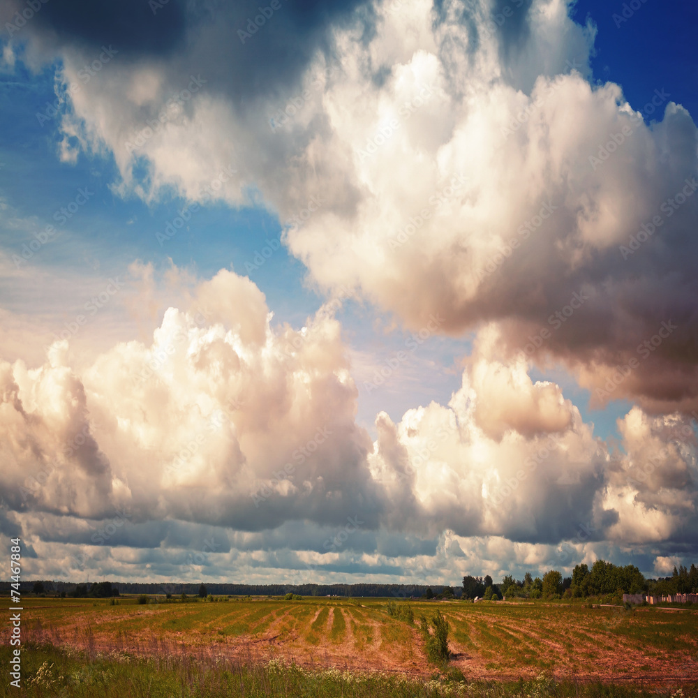 Empty country landscape with dramatic cloudy sky Empty country landscape with dramatic cloudy sky