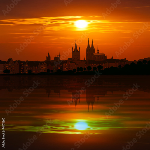 abstract background with silhouette of cologne and sunset
