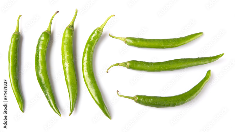 Green chili peppers over white background Green chili peppers over white background