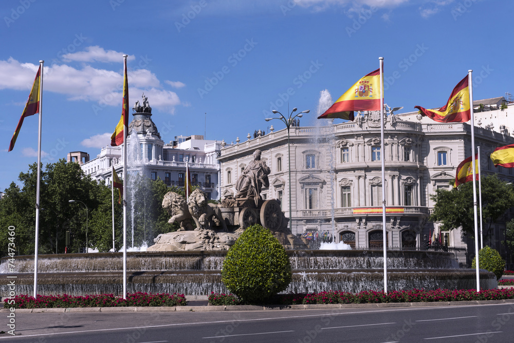 Statue of Cibeles, decorated with the flags of Spain