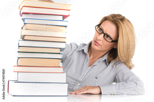 Portrait of confident female advocate looking at books.