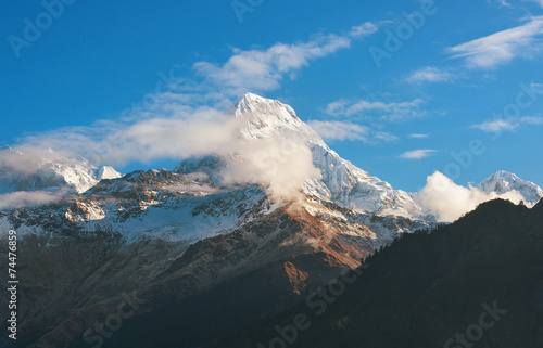  Himalayan snow mountain partly obscured by clouds