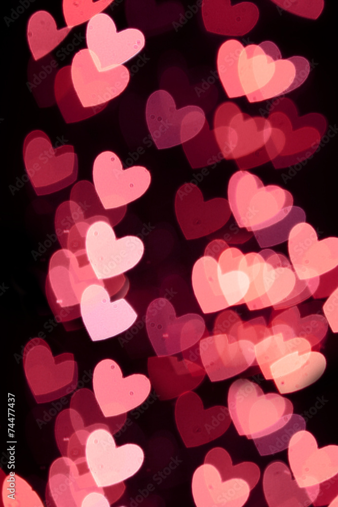 Defocused heart bokeh lights, abstract background