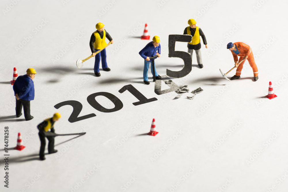 Miniature engineer change represents the new year 2014- 2015 Miniature engineer change represents the new year 2014- 2015