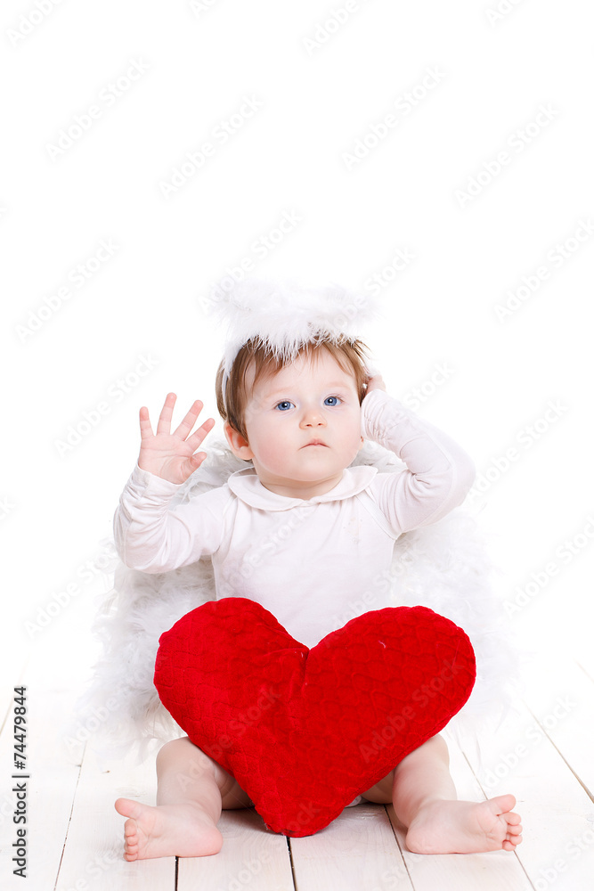 Little angel with red heart isolated on white. Little angel with red heart isolated on white.