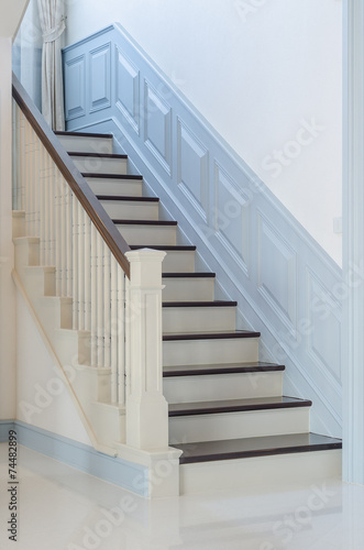 classic style wooden stair with white railing