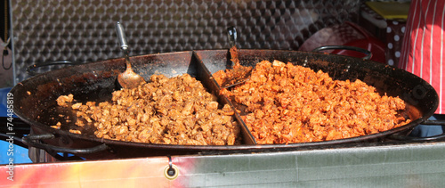 Фотография Fresh Food Being Cooked on an Outdoor Gas Stove.