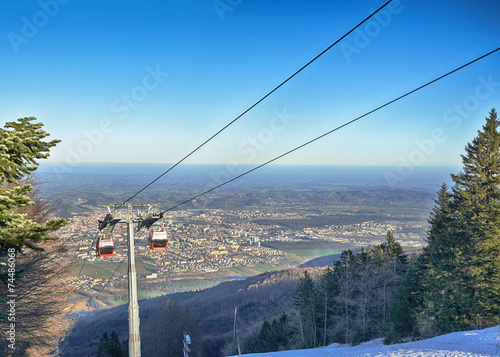 Cable car going to Pohorje over foggy Maribor photo