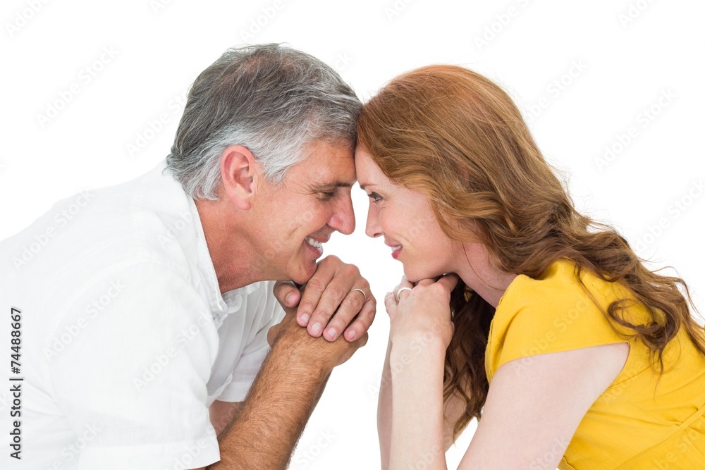 Casual couple smiling at each other Casual couple smiling at each other