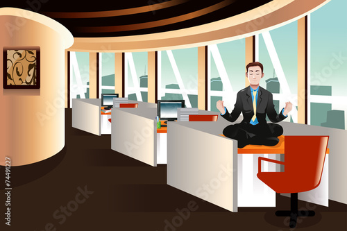 Businessman meditating in the office