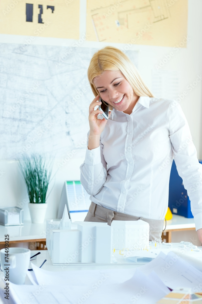 Businesswoman holding a mobile phone Businesswoman holding a mobile phone