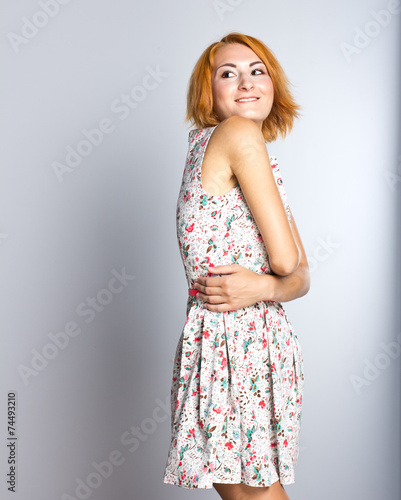 Beautiful young girl in a short cocktail dress.