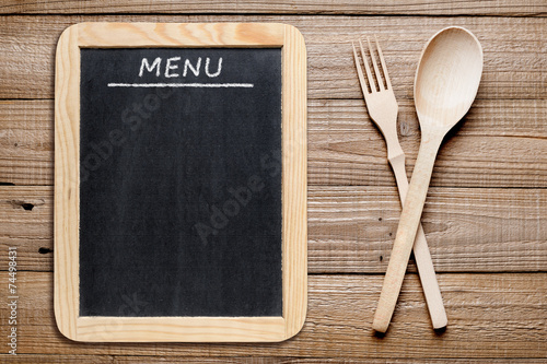 Blackboard menu and wooden fork and spoon
