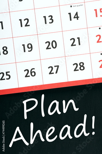 Plan Ahead! written on a blackboard next to a calendar