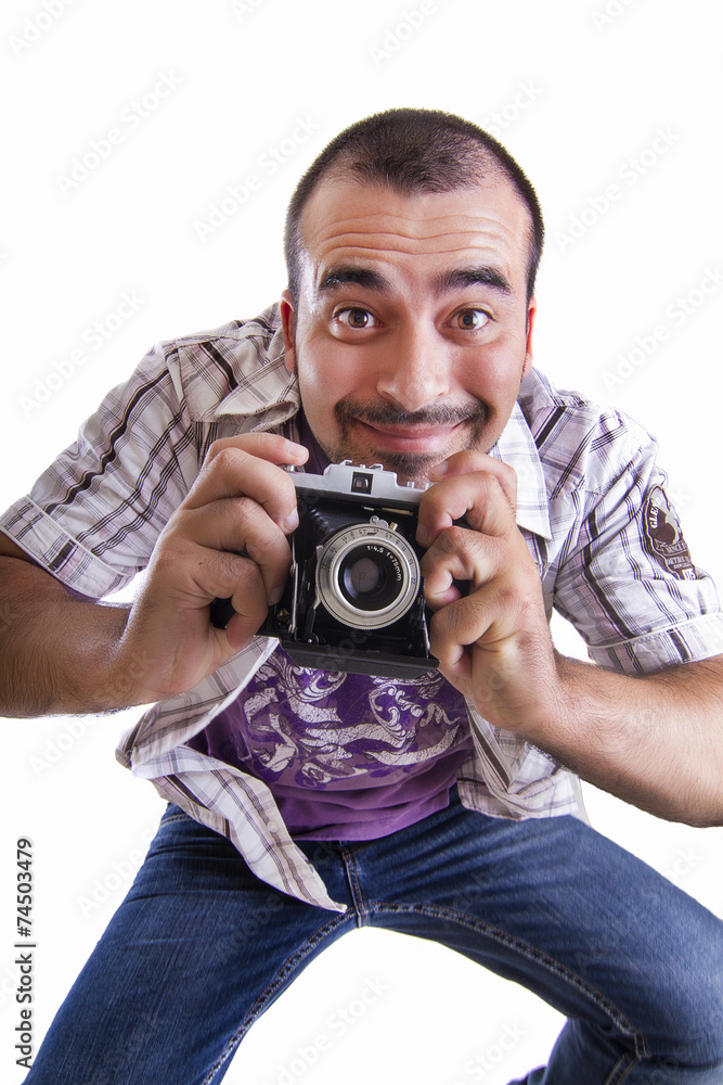 young happy man jumping with a camera young happy man jumping with a camera