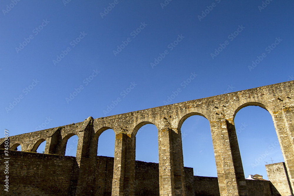 View of the historical aqueduct located in Evora city, Portugal.