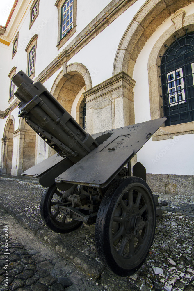 Close view of a cannon field artillery on the street.