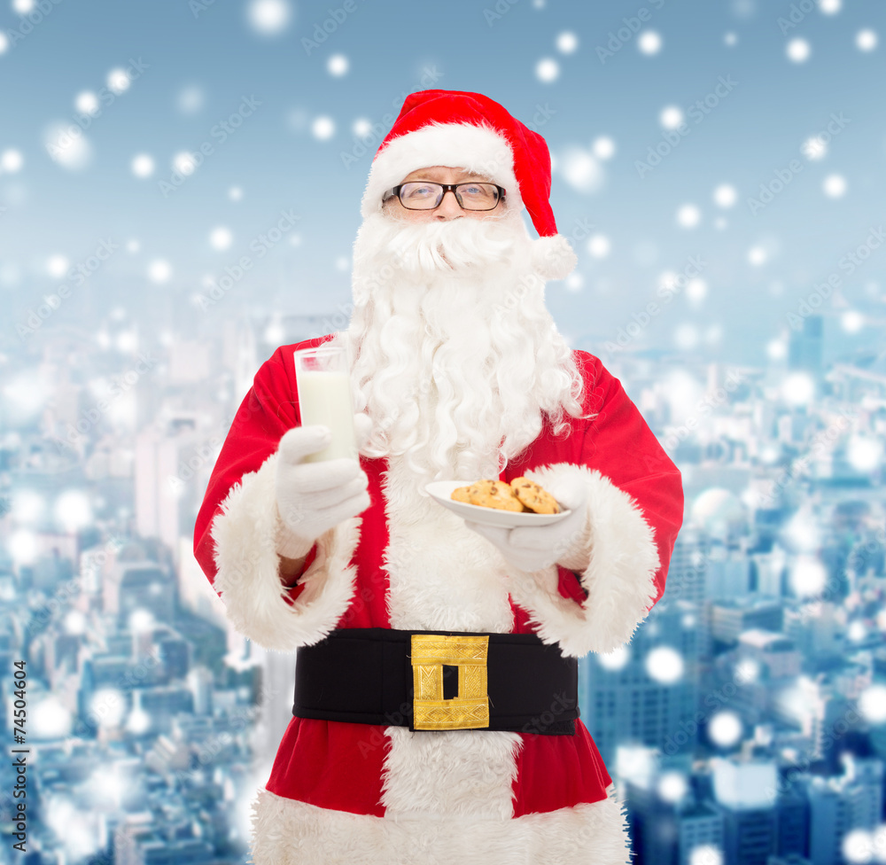 santa claus with glass of milk and cookies santa claus with glass of milk and cookies