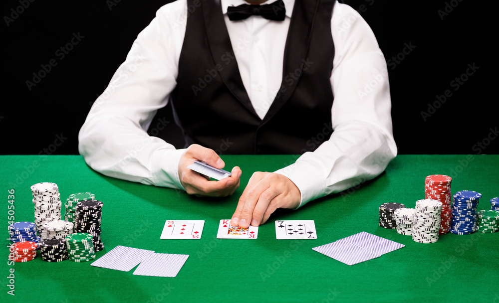 holdem dealer with playing cards and casino chips holdem dealer with playing cards and casino chips