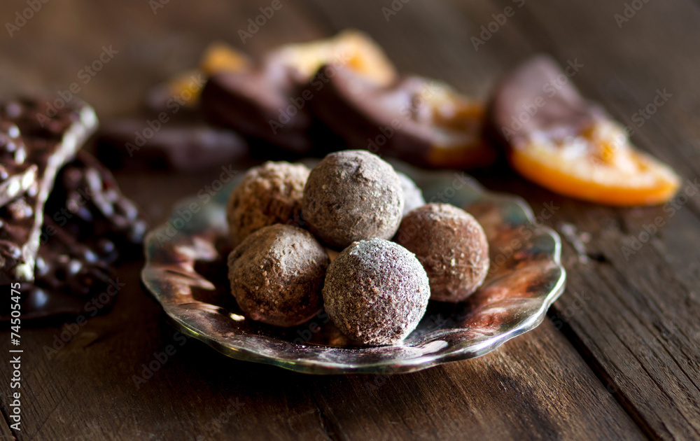 Chocolate, truffles and orange slices in dark chocolat Chocolate, truffles and orange slices in dark chocolat