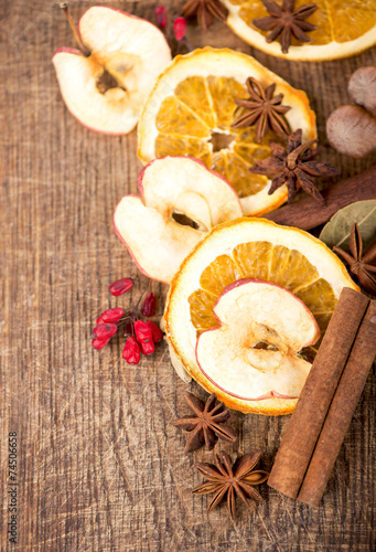 Christmas spices and dried orange sliceson photo