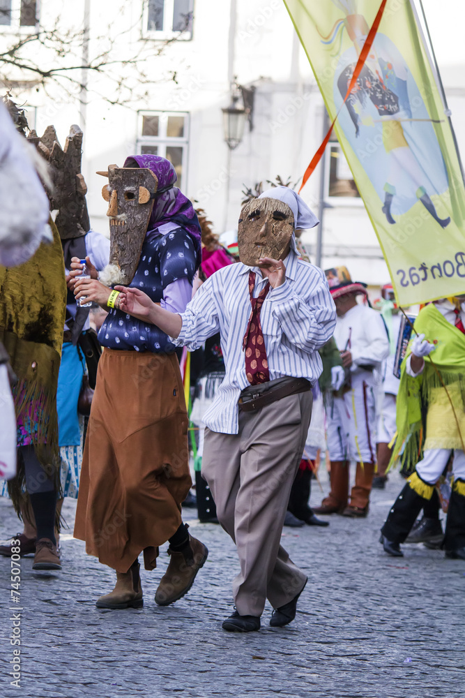 Naklejka premium Parade of costumes and traditional masks of Iberia