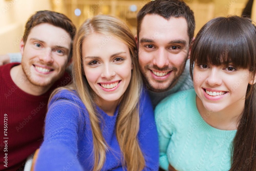 group of smiling friends taking selfie group of smiling friends taking selfie