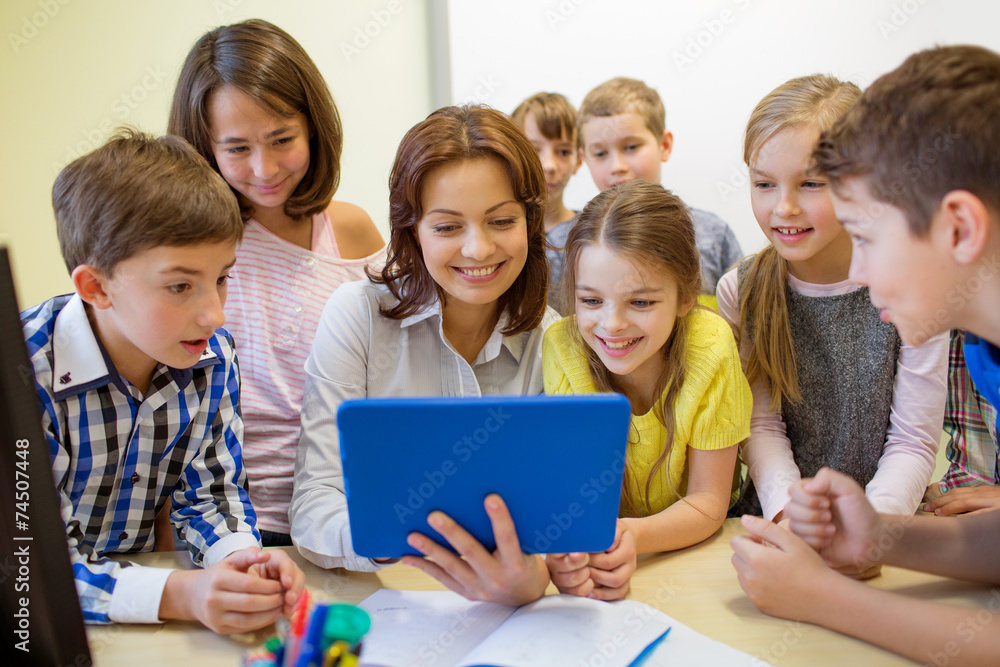 group of kids with teacher and tablet pc at school group of kids with teacher and tablet pc at school
