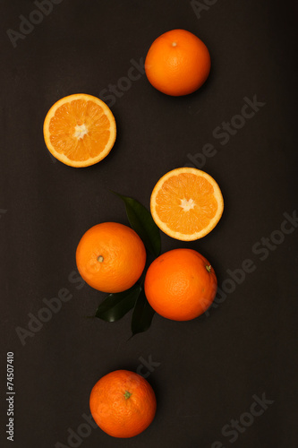 Group of oranges on the black background