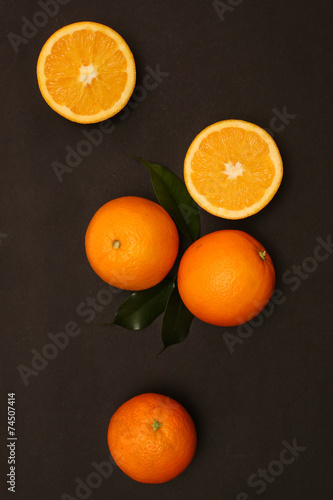 Group of oranges on the black background © triocean