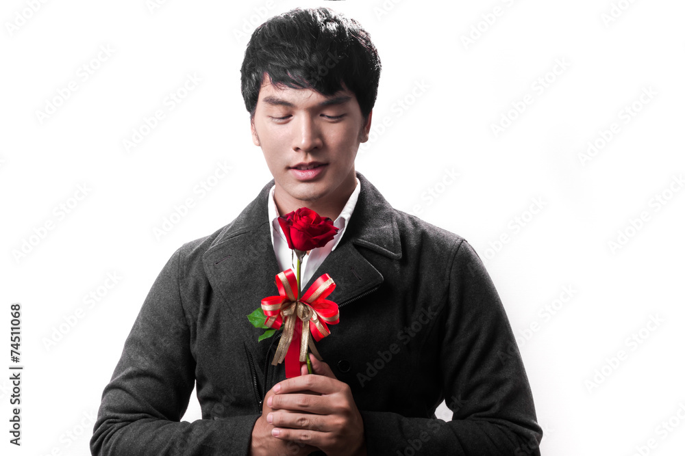 Asian handsome man hold the red rose with love Asian handsome man hold the red rose with love