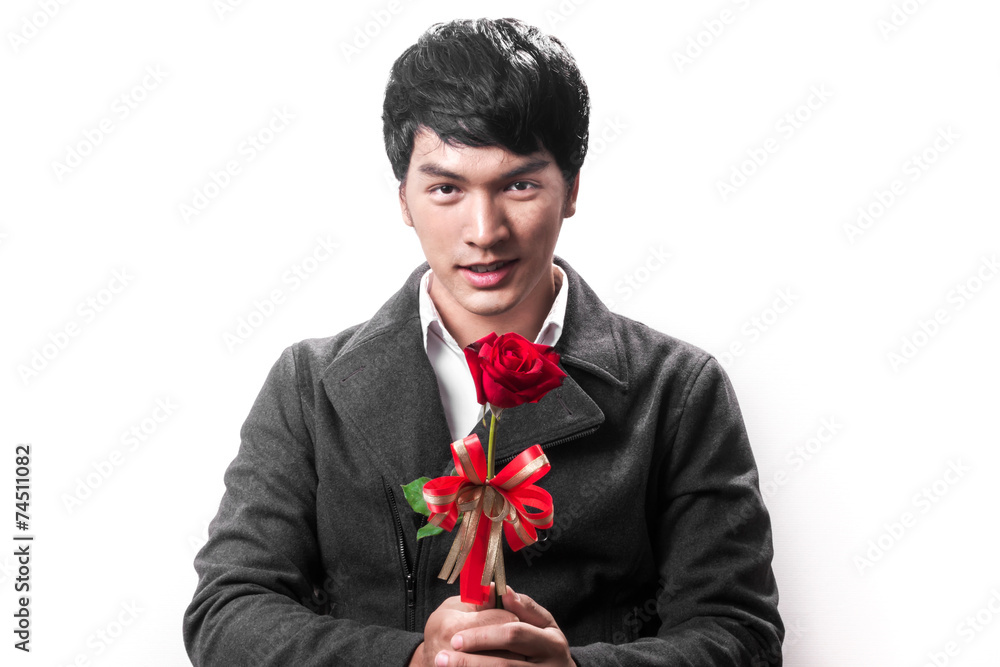 Asian handsome man hold the red rose with love Asian handsome man hold the red rose with love
