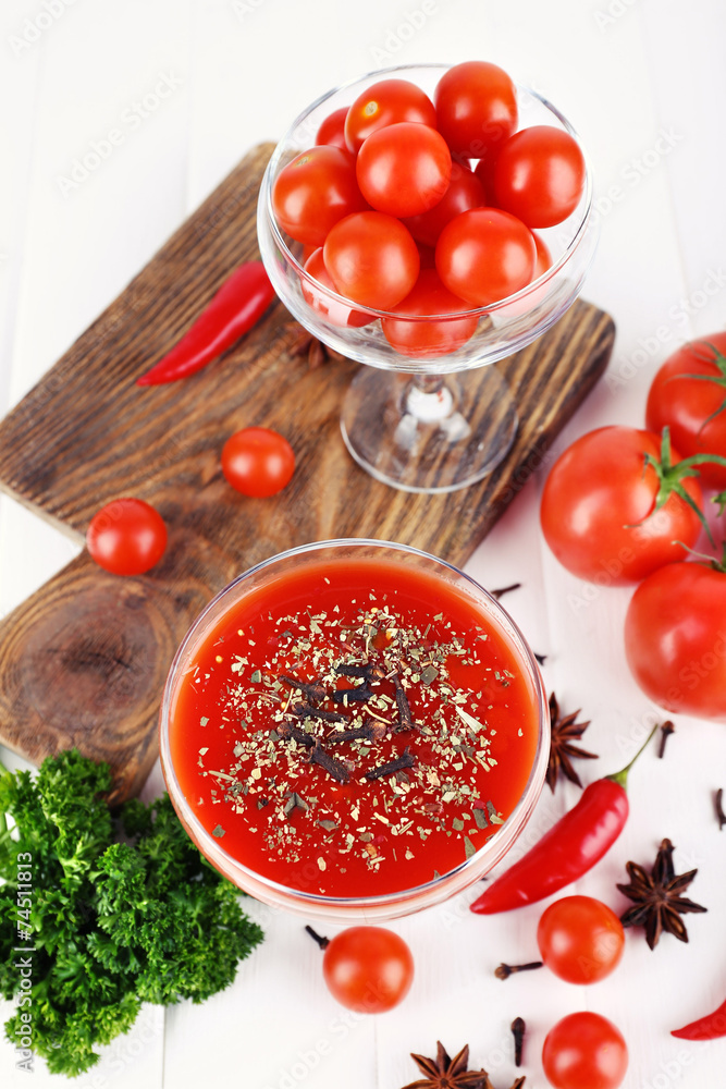 Tomato juice in goblet and fresh vegetables Tomato juice in goblet and fresh vegetables