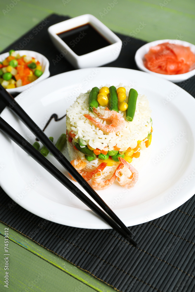Boiled rice with shrimps and vegetables on bamboo mat Boiled rice with shrimps and vegetables on bamboo mat