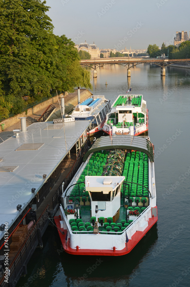 Naklejka premium Tourist Boats waiting for Sightseeing Passengers on the Seine Ri