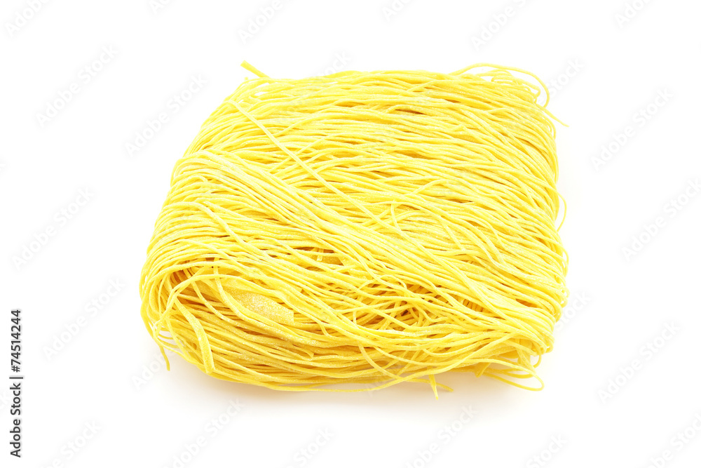 dried yellow Chinese noodle on white background