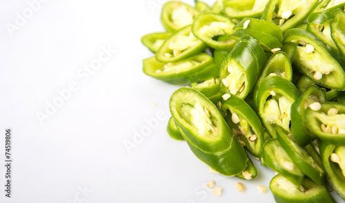 Wallpaper Mural Green chili peppers over white background  Torontodigital.ca