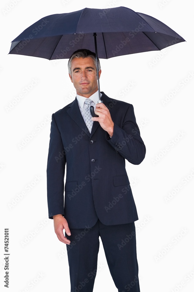 Cheerful businessman in suit under umbrella Cheerful businessman in suit under umbrella