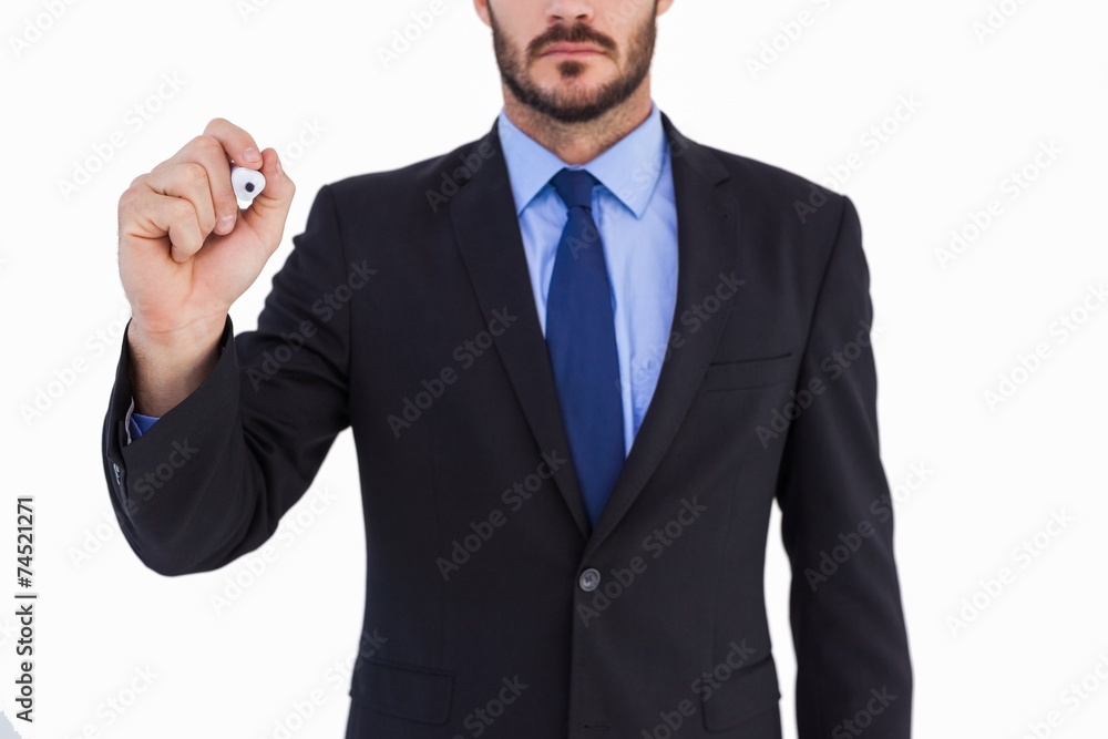 Focused businessman writing with marker Focused businessman writing with marker