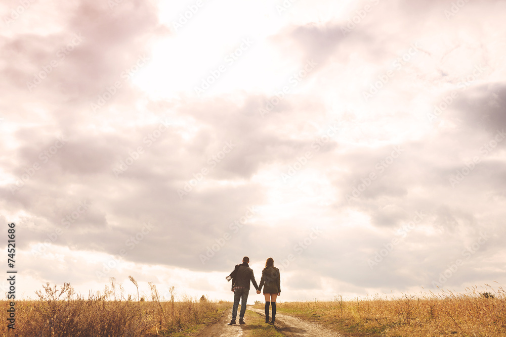 Landscape portrait of young beautiful stylish couple sensual and Landscape portrait of young beautiful stylish couple sensual and