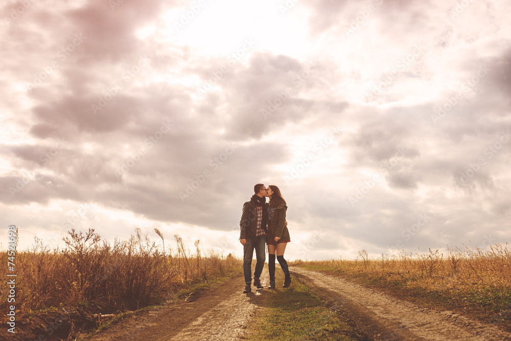 Landscape portrait of young beautiful stylish couple sensual and Landscape portrait of young beautiful stylish couple sensual and