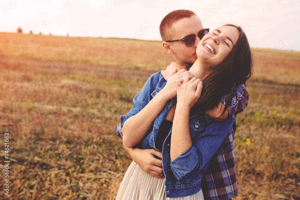 Landscape portrait of young beautiful stylish couple sensual and Landscape portrait of young beautiful stylish couple sensual and